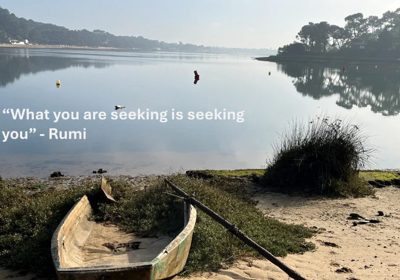 A boat on the shore of a lake with a message.